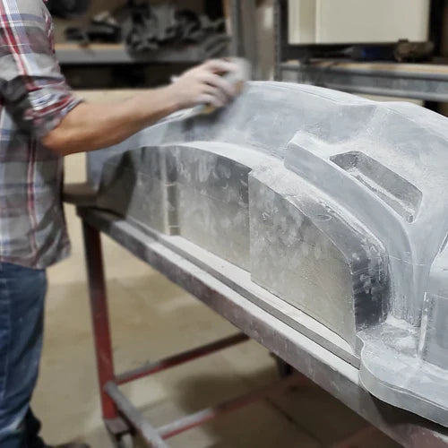 A person sands a plug