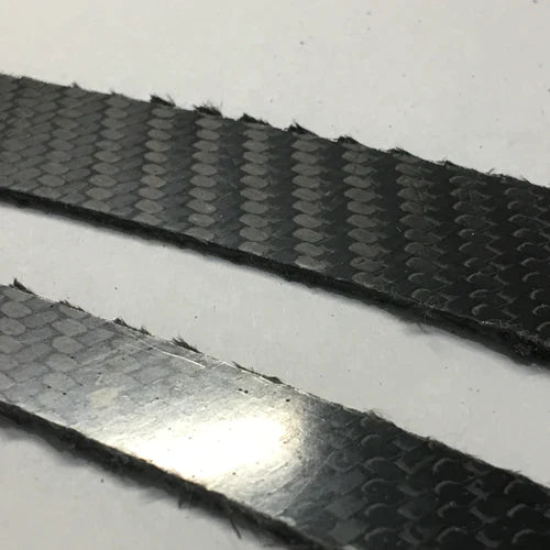 Two pieces of carbon fiber with frayed carbon edge