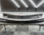 a carbon fiber finished rear spoiler sitting on a table
