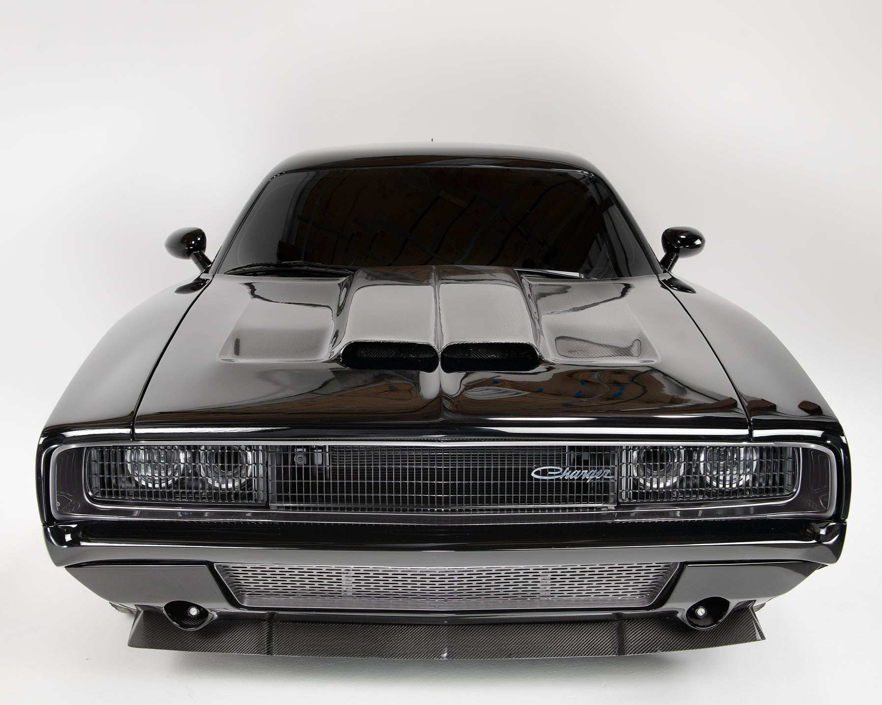 an all black carbon fiber dodge charger front angle